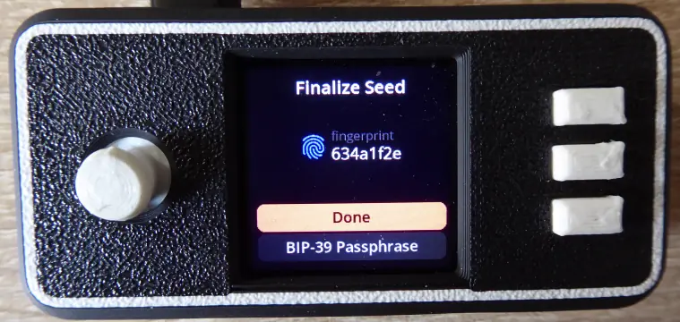 The SeedSigner “Finalize Seed” screen showing an 8-character fingerprint and a Done button.