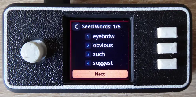 The SeedSigner screen “Seed Words: 1/6” listing four numbered example words.