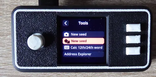 The SeedSigner Tools menu with “New seed” and the dice icon highlighted.